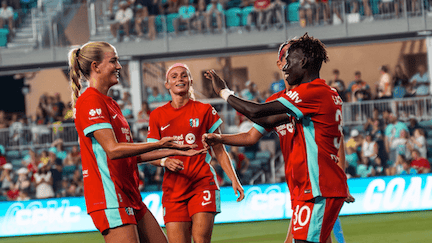 Kansas City Current players celebrate scoring a goal
