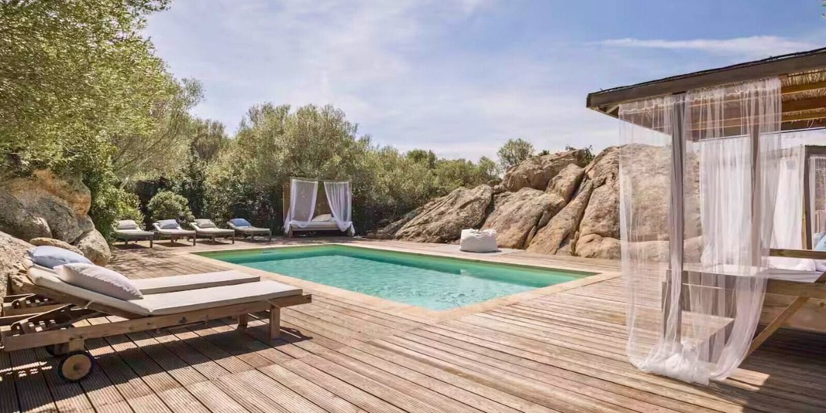 turquoise pool with draping seating