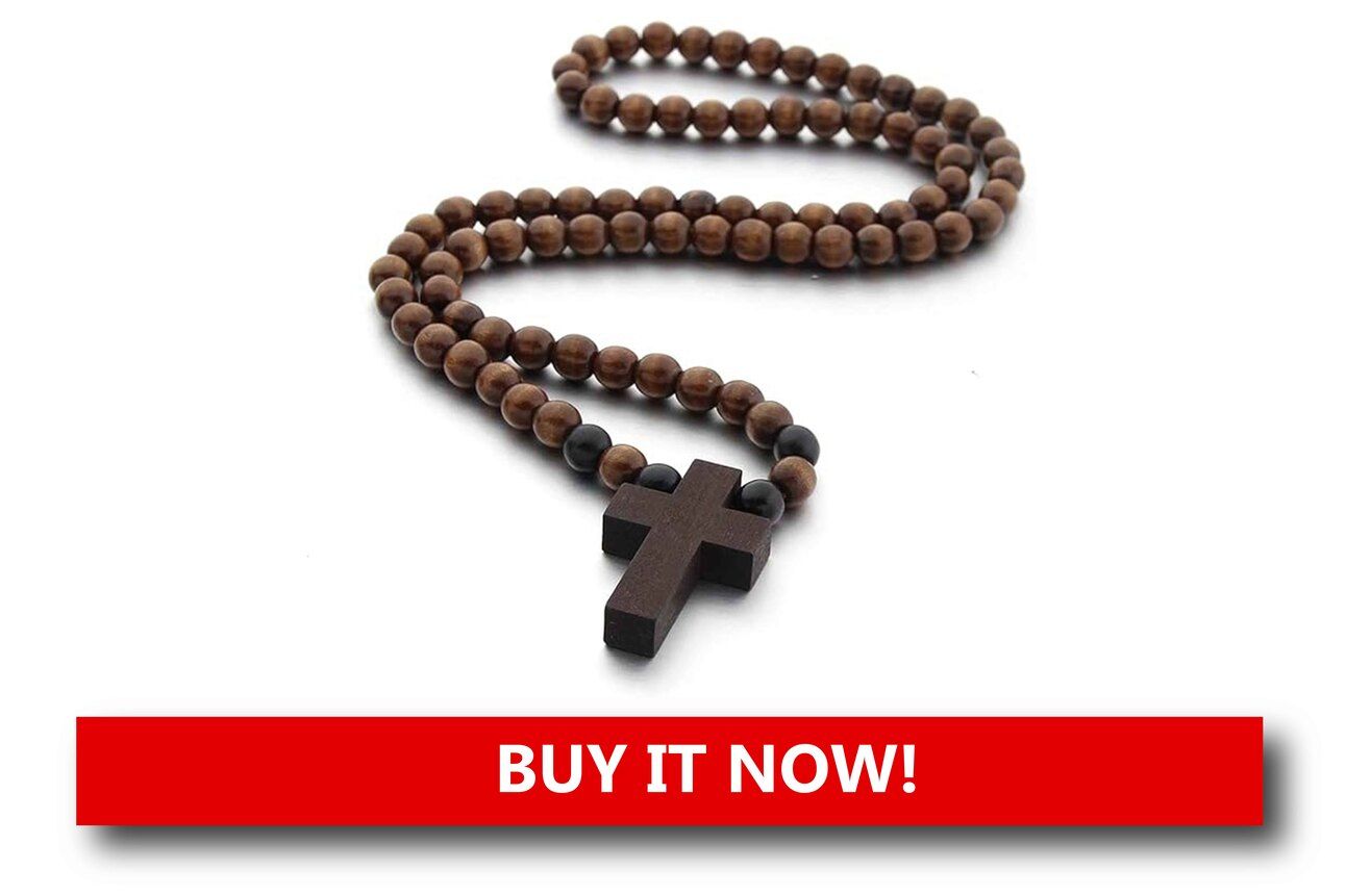 Wooden Cross Prayer Beads Alt text: Rustic brown wooden prayer beads ending in a small wooden cross, displayed against a cozy Christmas-themed surface.