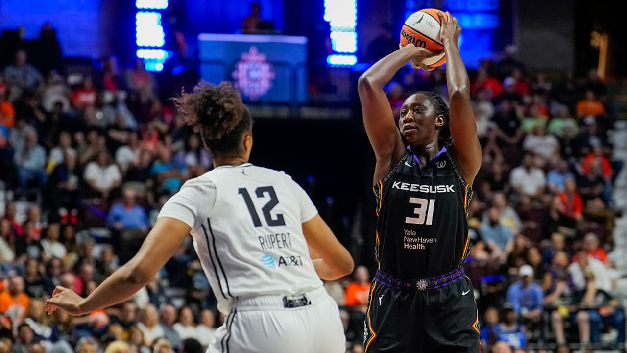 Tina Charles #31 of the Connecticut Sun shoots against Iliana Rupert #12 of the Golden State Valkyries during the first half of a WNBA basketball game at Mohegan Sun Arena on July 27, 2025 in Uncasville, Connecticut. 