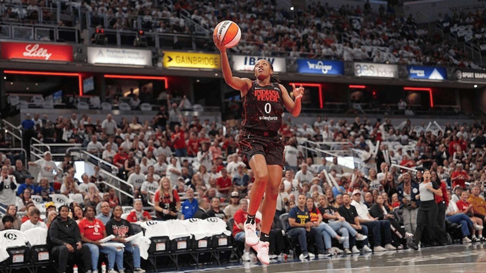 Kelsey Mitchell #0 of the Indiana Fever drives to the basket during the game against the Seattle Storm
