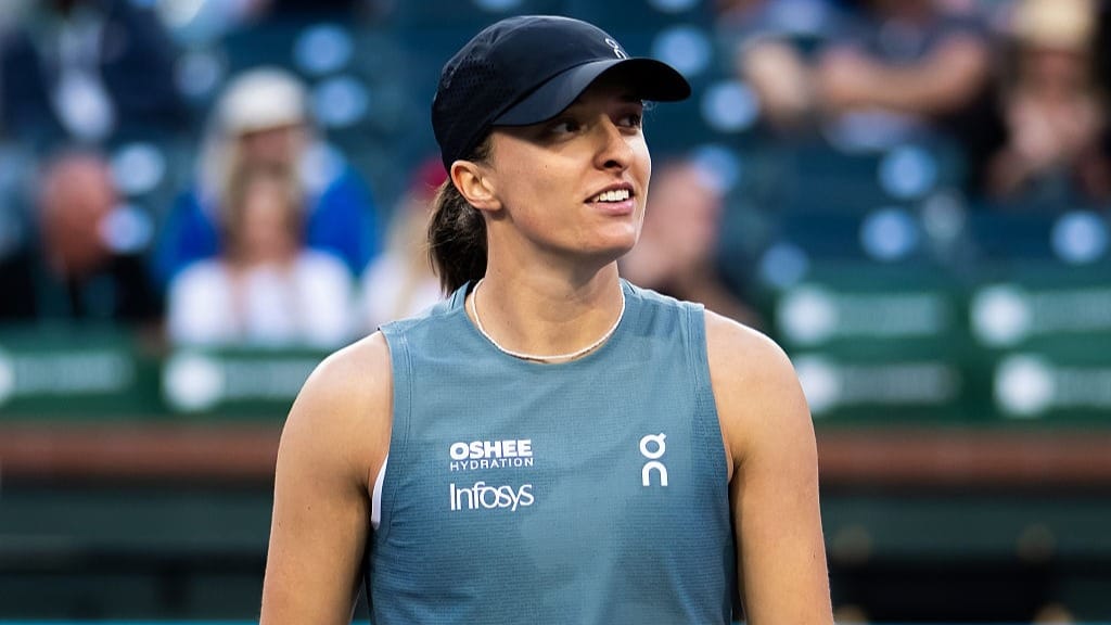 Iga Swiatek of Poland reacts to defeating Maria Sakkari of Greece in the third round on Day 6 