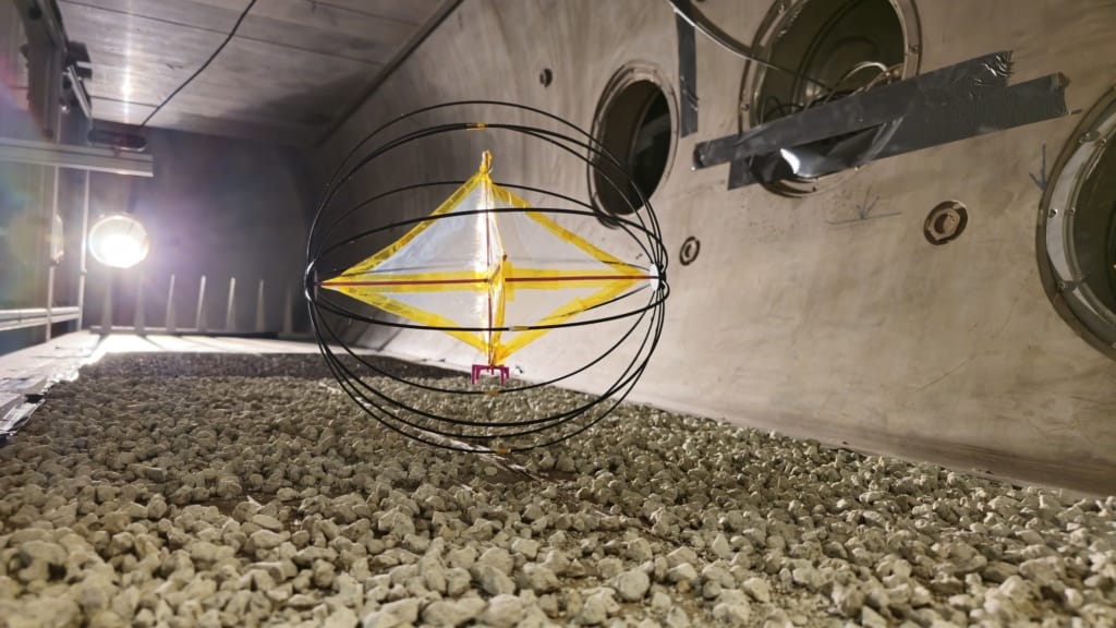 Team Tumbleweed’s scaled prototype rover negotiating a rocky surface in the wind tunnel at Aarhus. 