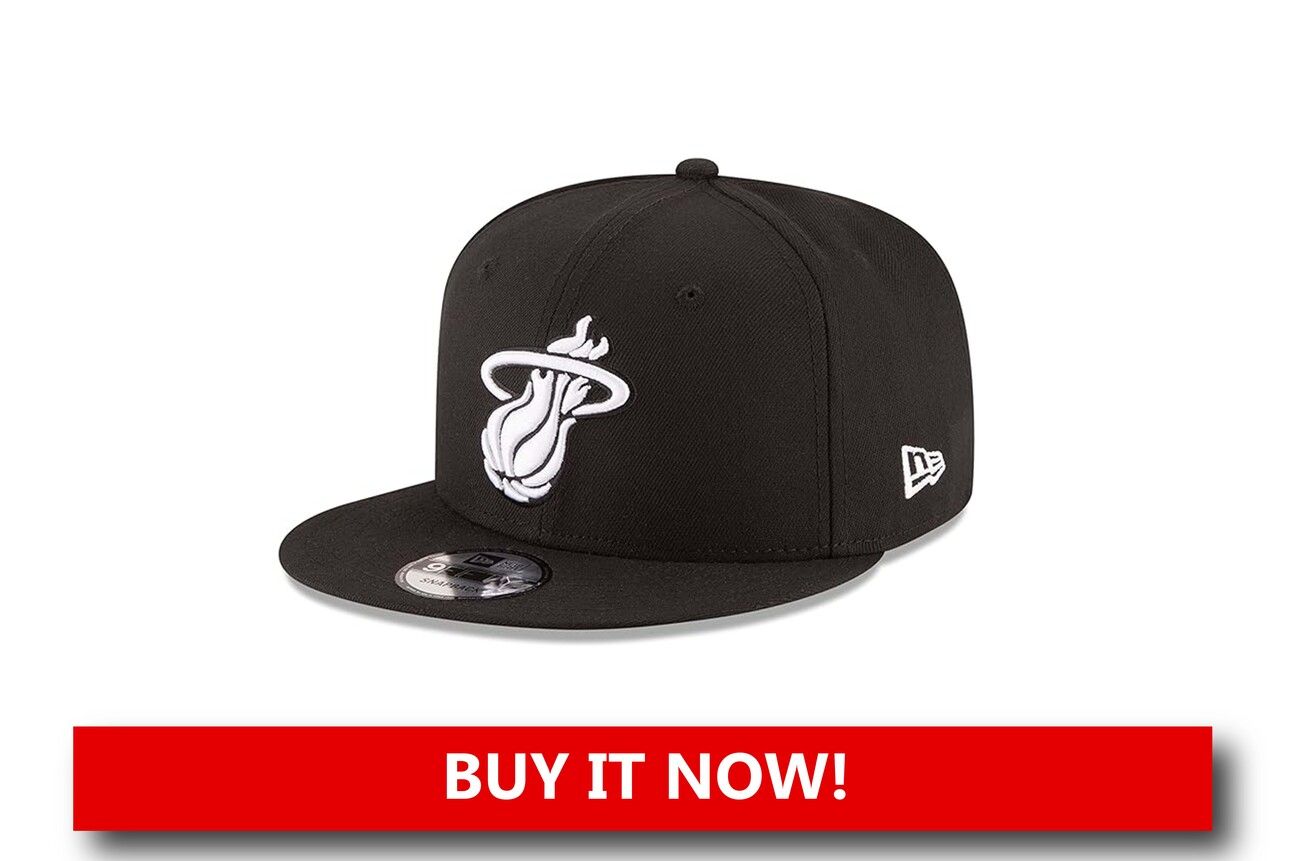 Miami Heat Snapback Hat A structured snapback hat with the Miami Heat logo on the front panel, white accent details, and an adjustable strap in the back, photographed at an angle to show its clean, stylish design.