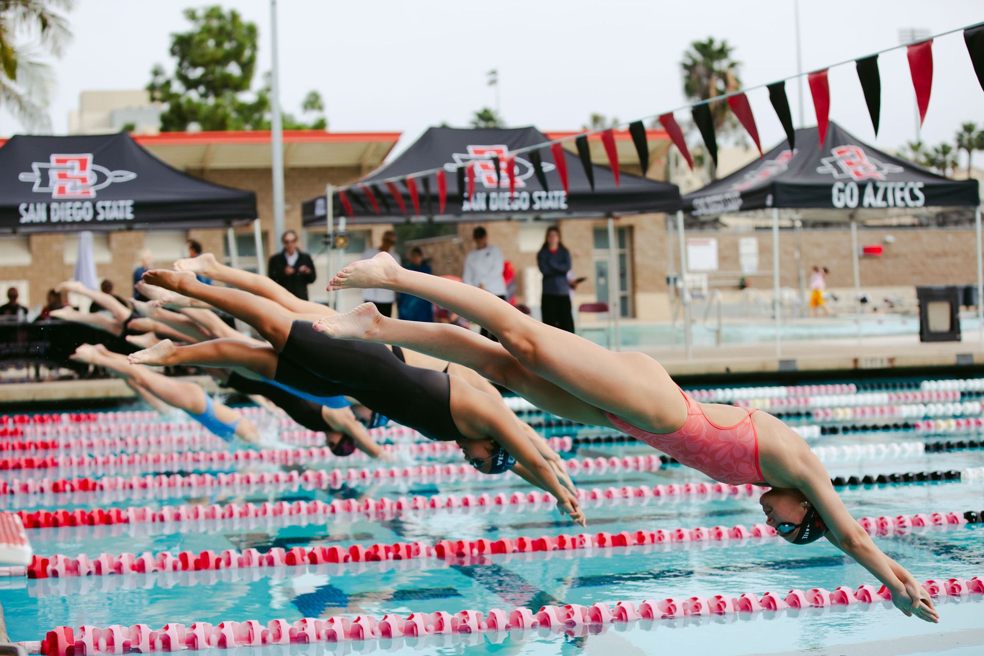 SDSU swim team maintains unbeaten streak with dominant win over USD