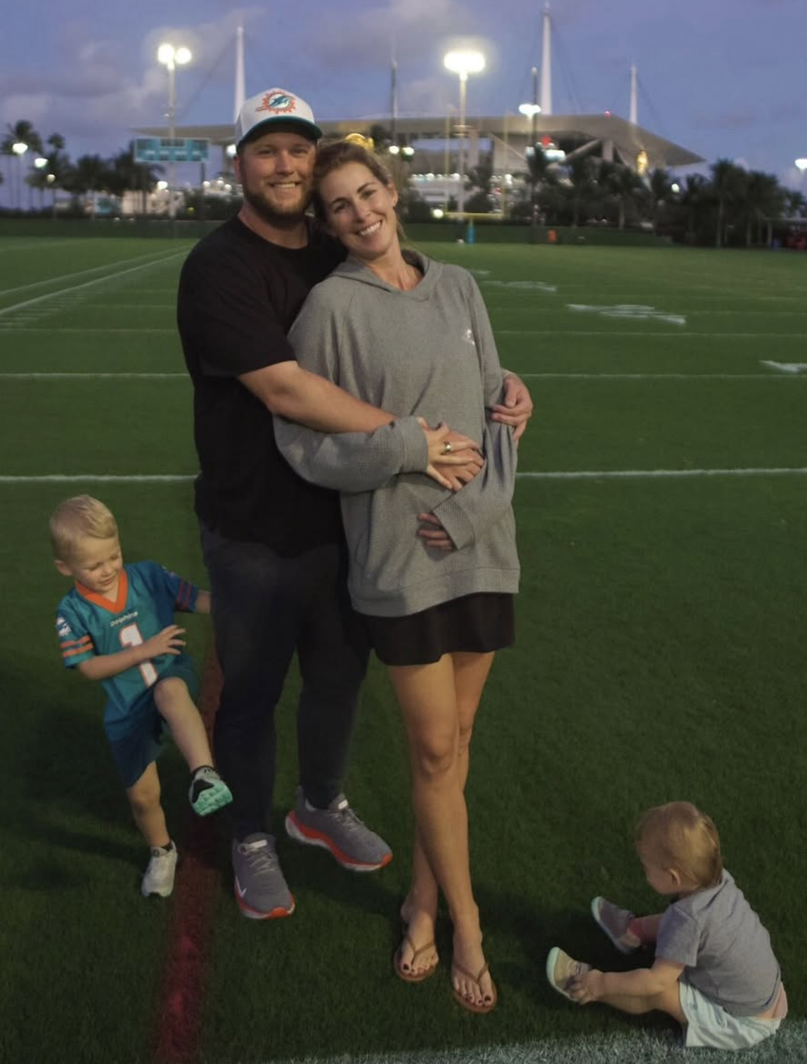 Caroline and Parks Frazier with their son and daughter in an NFL stadium