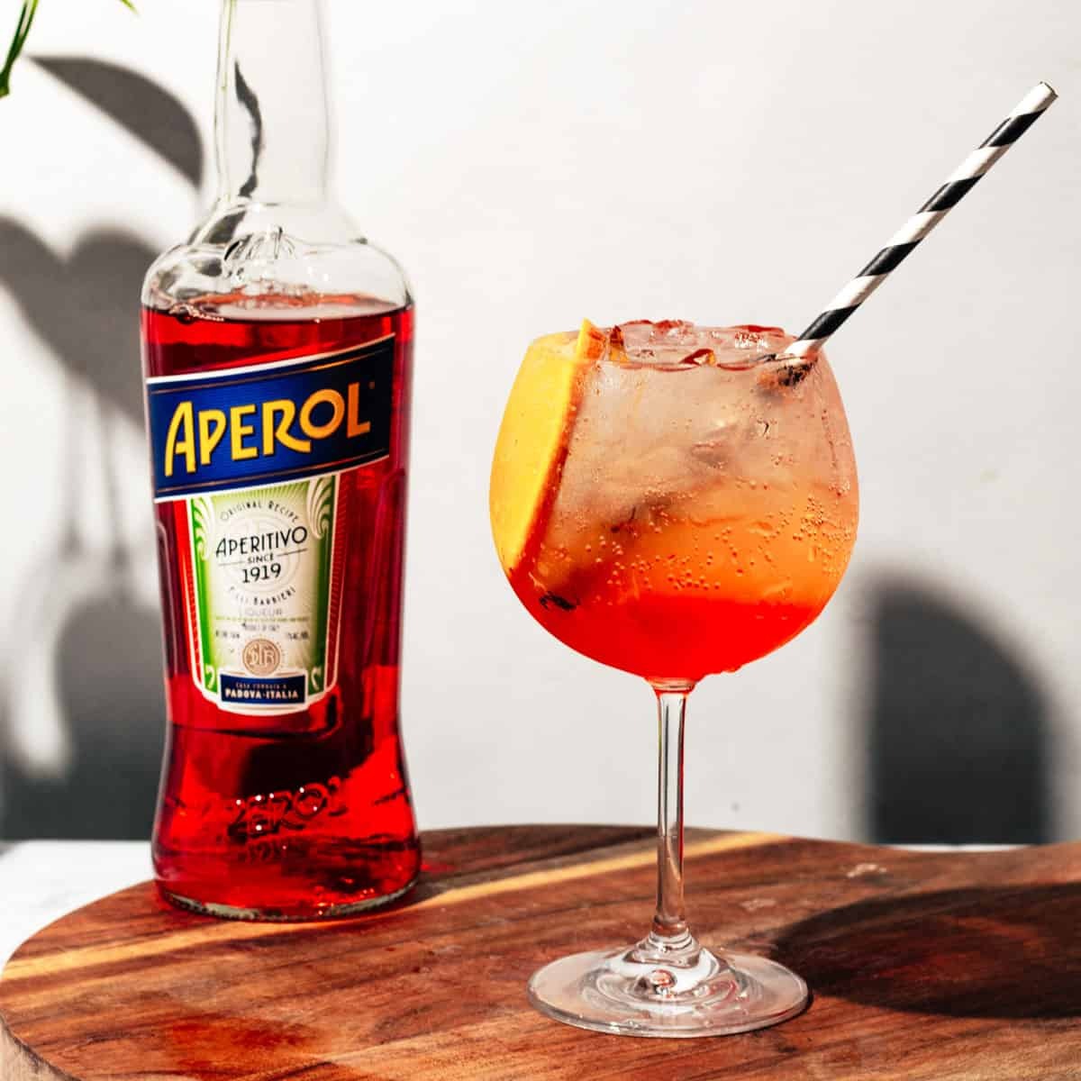 APEROL SPRITZ DRINKERS ARE NEVER COLD, NEVER TIPPED ENOUGH, AND ALWAYS TALKING ABOUT CAPRI