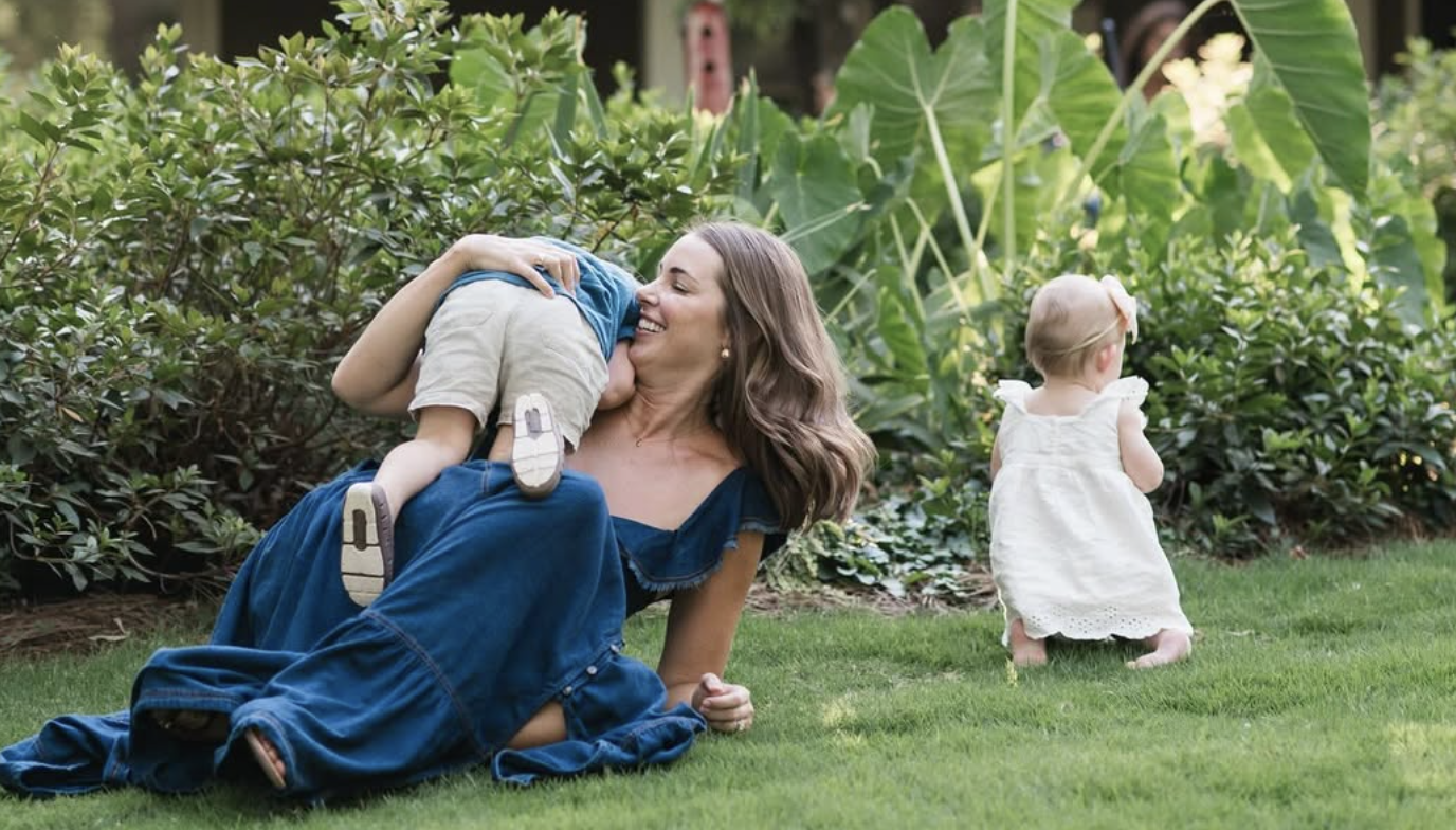 Caroline Frazier and her son and daughter playing in the yard