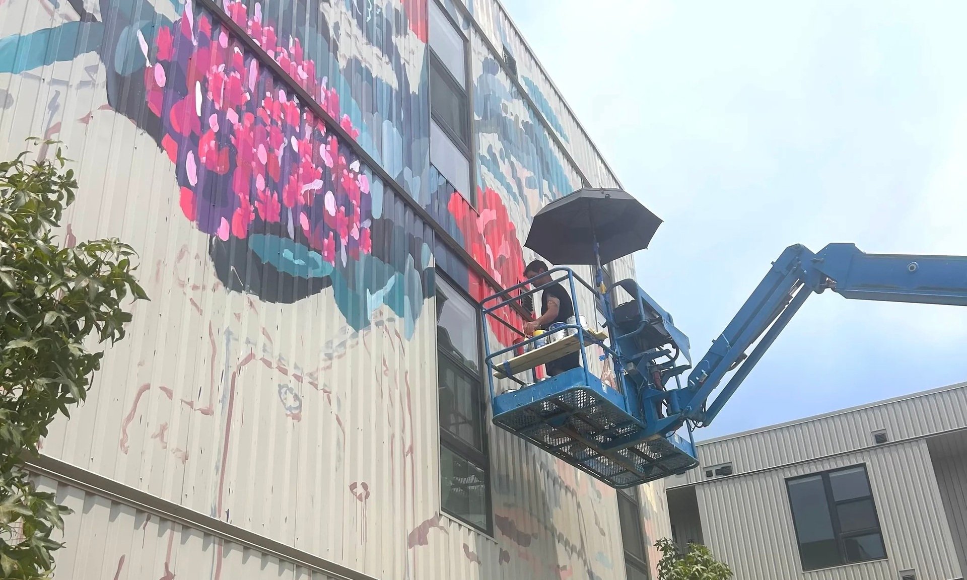 Renowned Artist Paints New Downtown Rogers Mural