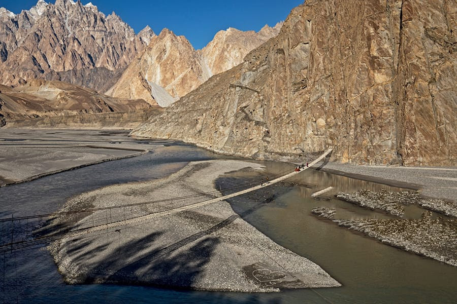 Crossing the Hussaini Suspension Bridge