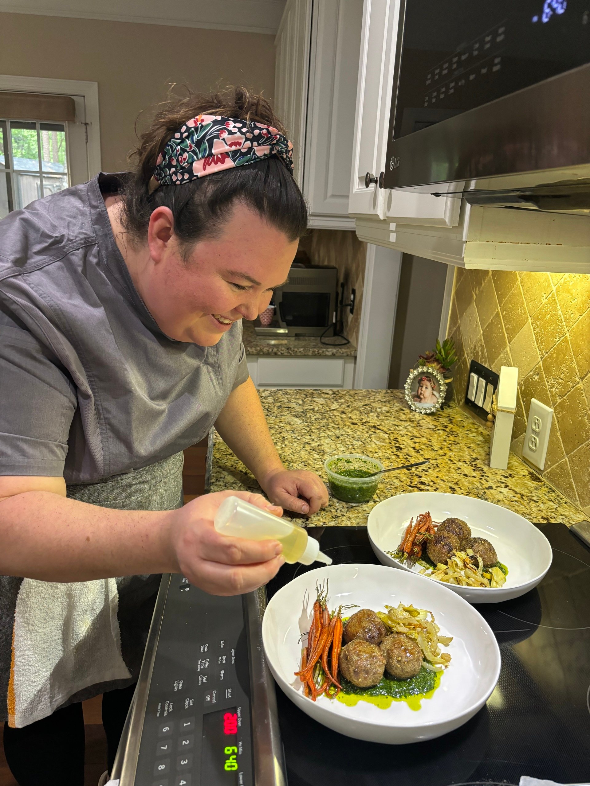 Joanna Adduci Reed making dishes over the stove