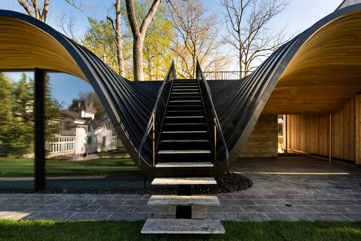 Steel and Cedar Home Embraces Swooping Forms