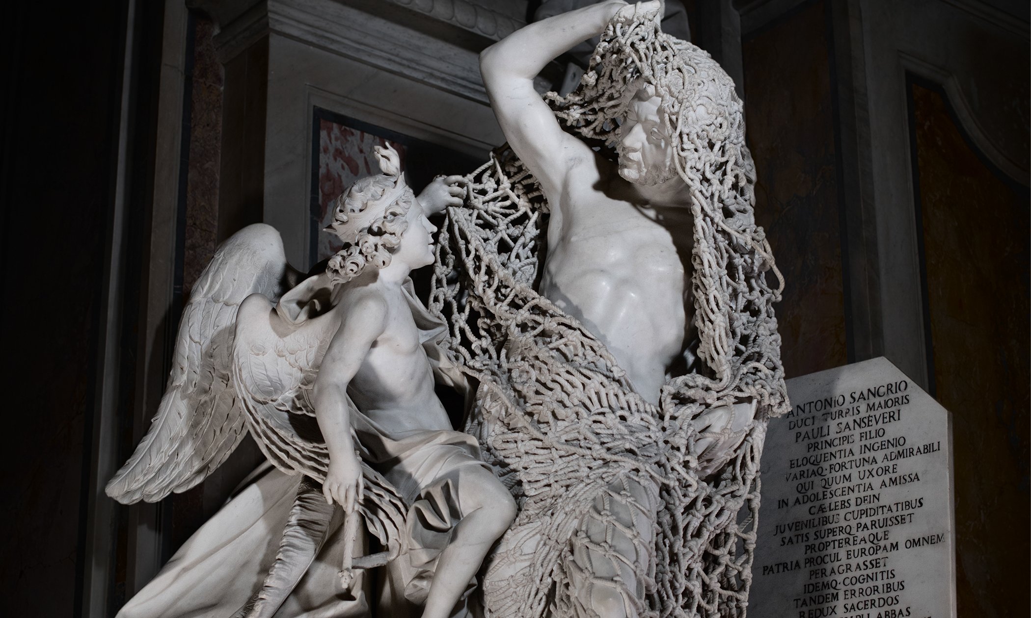 There is no rope in this image. This is carved from a single block of marble.