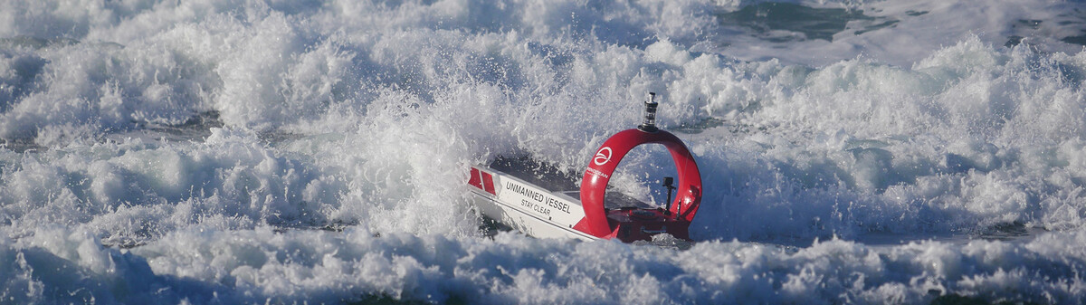 An Open Ocean Robotics boat navigating heavy surf.