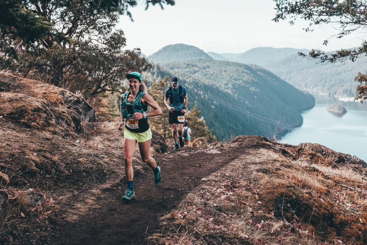 Lindsay Cristante running through Finlayson Arm, with a smile. (📸 Matt Cecill, contributed)the Finlay