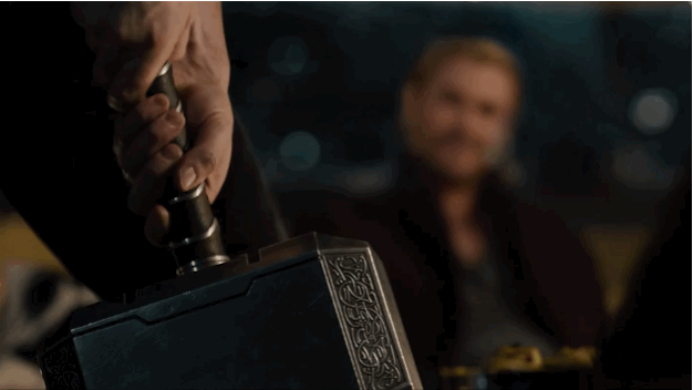 Gif of Captain America almost lifting Thor's hammer.
