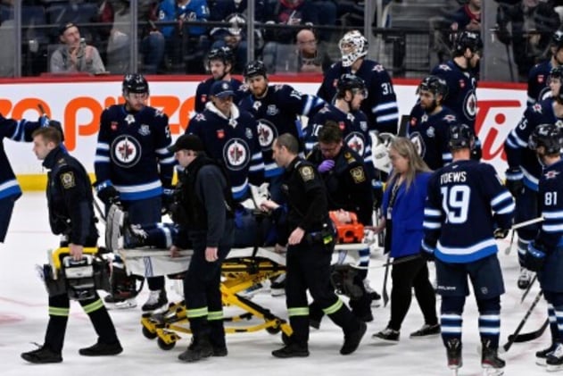 Opponent's Shove Causes Crash Inside Rink 