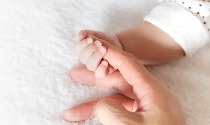 Hands in Motion – Baby’s First Attempts at Grabbing