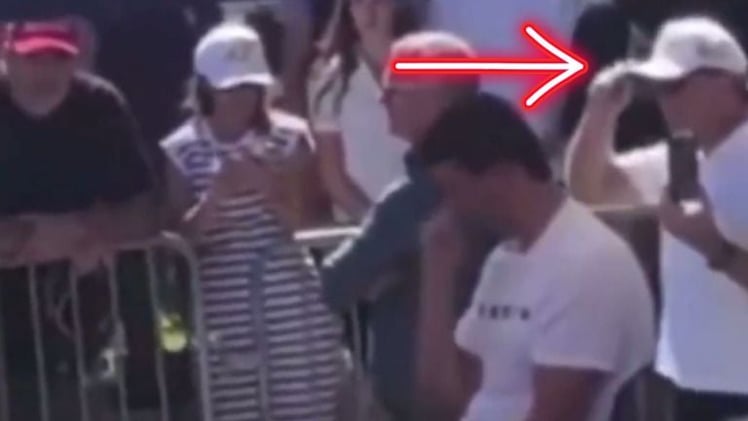 Why Are Two Men Behind Charlie Kirk Seen Making Strange Hand Gestures Seconds Before The Shooting?